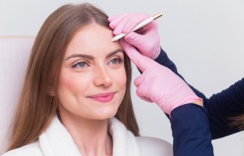 Woman wearing bathrobe in beauty clinic, aesthetics, patient, cosmetic procedures. botox application. anti wrinkle and anti aging.