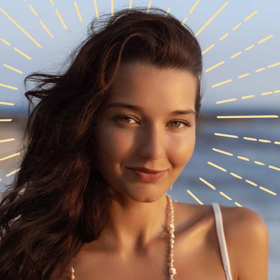 Smiling woman with radiant skin in natural sunlight